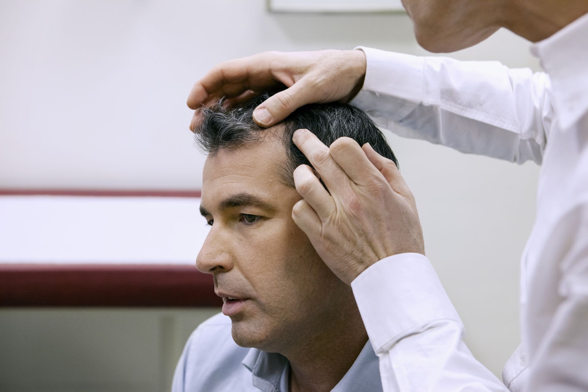 Hair and scalp being examined during a professional consultation